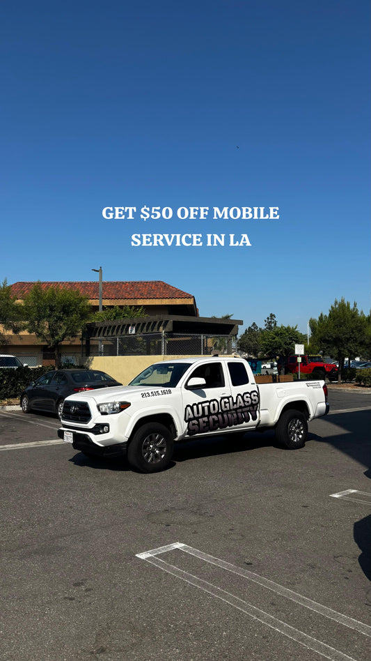 White pickup truck with Auto Glass Security branding offering $25 off mobile windshield replacement service in Los Angeles — fast, affordable auto glass repair.